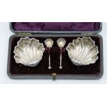 A Victorian cased set of silver shell shaped salts on ball feet, approx 50mm, three ball feet, along