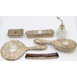 A Victorian style silver mounted dressing table set to include Mirror, comb and two brushes, profuse