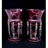 A pair of Victorian ruby glass/mantle/table vases with glass droplets, 30cms high approx