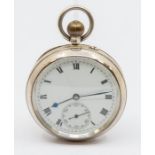 A silver open faced pocket watch, white dial with black Roman numerals, subsidiary dial and blue