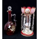 A late 19th Century ruby glass and hand painted garniture with glass droplets along with early