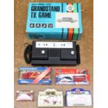 A boxed Adman Model 2000 Grandstand T.V. Game, original box; together with two boxed Corgi diecast