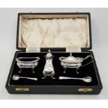 A cased silver cruet set, by Cooper Brothers & Sons Ltd, Sheffield 1938, comprising; lidded