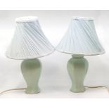 A pair of modern table lamps, extensive damage and repair of to both bases (2) AF with shades