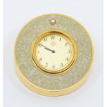 A Mikimoto International travel clock, comprising a gold tone round dial, with number markers,