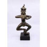 A Burmese bronze deity  with wooden stand  height: 28.5cm (without stand), 34cm (with stand)