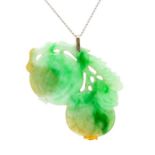 A Chinese jade pendant in the form of double cherries, a symbol of good luck, size approx 55mm, on