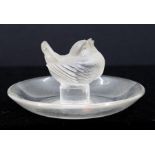 Lalique pin tray with twittering bird to centre. Diameter approx 9cm. Signed Lalique, France to the