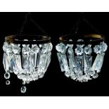 A pair of early 19th Century style cut glass small chandeliers possibly German, gilt metal frames (