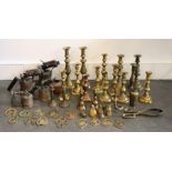 A large collection of 19th cent brass candlesticks, horse brasses and blow torches , qty