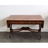 An early 19th century Irish flamed mahogany Regency sofa table Provenance from an Irish Country