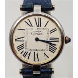 A silver Must de Cartier ladies' wrist watch, automatic movement, having signed circular Roman