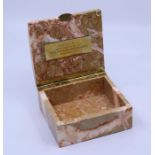 A marble box made from marble from the Royal stock exchange when demolished in 1970
