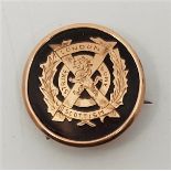 WW!/Military Interest: A London Scottish 9ct. gold mounted circular tortoiseshell sweetheart brooch,