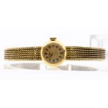A ladies 18ct gold International Watch Co, round cream dial, with applied gold tone baton markers,