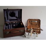 A gentleman's leather cased travelling vanity set, c.1910, the fitted interior with various silver