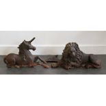 A pair of large 19th cent cast iron Lion and Unicorn fireside irons