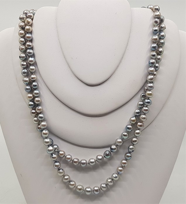 A double row cultured pearl necklace, with 14ct. white gold triple "daisy" clasp, set three round - Image 2 of 3