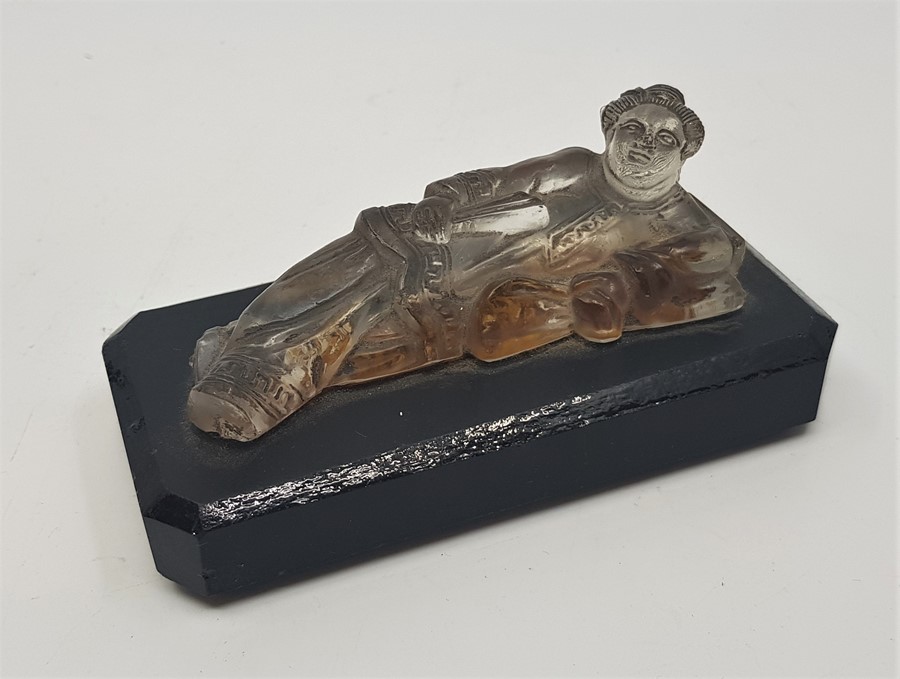A Chinese Qing dynasty carved crystal reclining Guanyin paperweight, length 11.3cm.