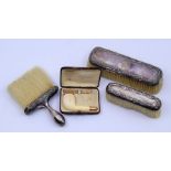 A 9ct gold mounted pipe and a collection of silver mounted brushes