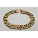 A precious yellow metal and turquoise set fancy link bracelet, (two turquoise stones lacking, yellow