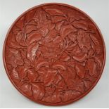 A Chinese cinnabar dish, with character marks to base, diameter 35.1cm.
