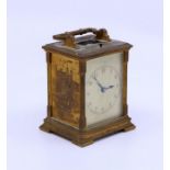 An unusual early 20th century Striking carriage clock with engraved scenes of London to the sides,