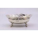A silver pierced bowl raised on four outswept legs 180g