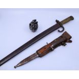 A 19th cent Prussian bayonet, similar smaller bayonet and a deactivated WW2 Period Hand granade