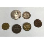 Silver 19th Century trade tokens with other tokens. includes Exeter silver shilling (holed), 1811