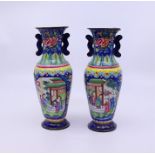 A pair of Chinese Qing dynasty blue enamel vases