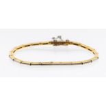 An 18ct gold and platinum bracelet, comprising articulated rectangular links with goold reverse and