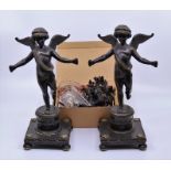 A pair of Regency bronze lusters of outswept putti , slight faults Provenance from an Irish 18th