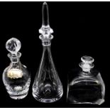 Three various glass decanter and stoppers; one cushion shaped engraved with Dutch House of