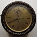 A scarce mid 19th century circular Marine oak cased wall clock, the brass dial with Roman numeral