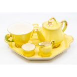 A Royal Winton pattern no: 464 yellow Petunia breakfast set for one to include: teapot, cup, sugar