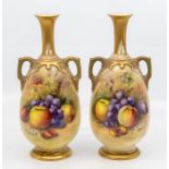 A pair of early 20th Century Royal Worcester two handled vases, shape no: 1762, decorated with fruit