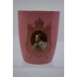 A Royal Doulton porcelain curved sided pink ground commemorative beaker, 1937 Coronation, transfer