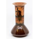 An Ault globe and shaft vase, painted with stylised windmill, coloured in tones of brown and