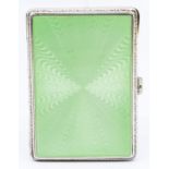 A George V silver and green enamel rectangular cigarette box, the cover with radial decoration,