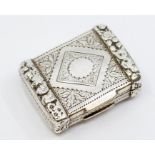 A George III silver vinaigrette, book shaped with engraved body with raised foliate border, gilt