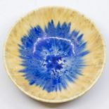 A Ruskin Crystalline glazed bowl, circa 1930, relief moulded dish form with three bracket feet,