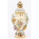 A German possibly Meissen two handled reticulated pot pourri and cover, the body painted with couple