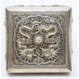 A Chinese 925 silver box and cover, the cover repousse with a pair of Dragons within shaped frame