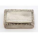 A George III silver snuff box, the body and cover chased with ridged decoration, the top section