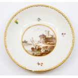 An 18th century Frankenthal porcelain saucer, the reserve painted with a Harbour scene with