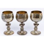 A set of three Modern silver goblets with rose bud stems, gilt bowl interior, hallmarked by Barrow