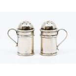 A matched pair of Victorian silver pepperettes, modelled as flour dredgers by Saunders & Shepherd,