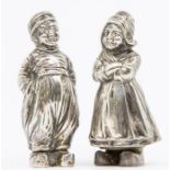 A pair of early 20th Century silver pepperettes in the form of a Dutch girl and boy by Lugwig