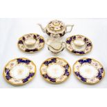 A Coalport cobalt blue Batwing pattern no: 2665 part tea service to include: four cups, two saucers,
